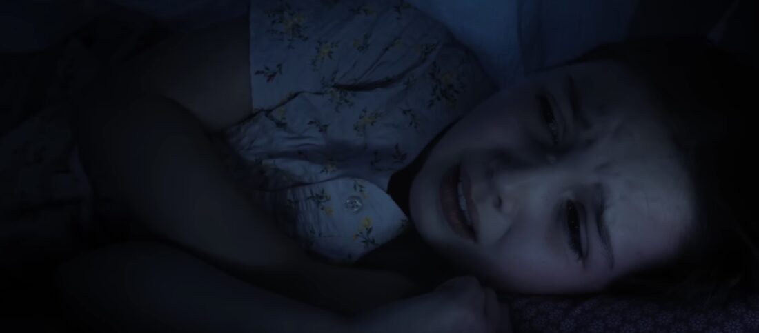 Aurora sobbing in fear under her covers in Dust Bunny