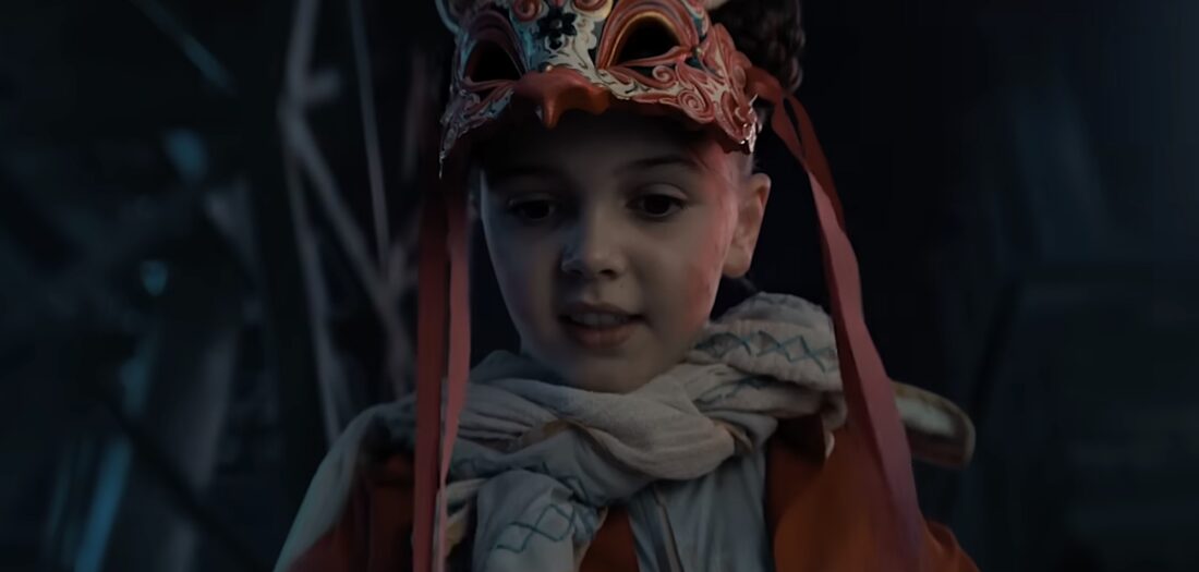 Aurora in a bunny mask looking down gleefully at 5B fighting in Dust Bunny