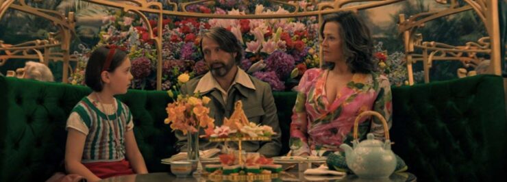 Aurora, 5B and Laverne seated at a table in Dust Bunny