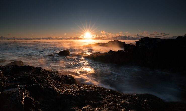 Photo of a sunrise over water